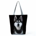 Close-up detail of the vivid Siberian Husky dog print design on this black tote bag. - Husky Print (hl5112)