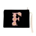 Detailed view of black cosmetic pouch with pink daisy letter F design and practical wrist strap. - Letter F Style (xbk2867)