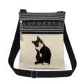 Detailed view of the black and white cat print crossbody bag, showcasing zipper and strap. - Style (xk1306)