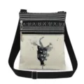 Canvas crossbody bag detail showing black cat ink print, dual zippers and adjustable strap. - Style (xk2493)
