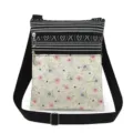 Detail view of the floral printed canvas crossbody bag featuring dual zippers and adjustable black strap. - Floral Stripe Patchwork Style (xk12508)