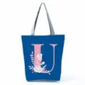 Blue canvas tote bag with pink letter U and floral print, stylish large shoulder bag for daily use. - Letter U