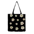 Detailansicht der schwarzen Tragetasche mit zarten beigen Blumenmustern und stabilen Griffen. - Schwarz Beige Streublumen (hm12530)