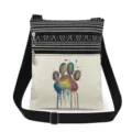 Vue détaillée du sac bandoulière en toile avec imprimé patte colorée et double fermeture éclair. - Style Patte de Chat Aquarelle (xk4379)