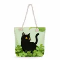 Black cat print tote bag detail showing green leaf illustration and thick rope handles design. - Black Cat With Green Leaves Style (msk2479) / 45x35x12cm