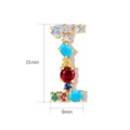 Close-up detail of a colorful gemstone letter pendant, cubic zirconia crystal and copper. - Letter I / 21mm x 9mm