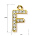 Detailed view of gold letter F pendant, paved with sparkling cubic zirconia stones. - Letter F
