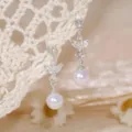 Squisiti orecchini pendenti perla zircone, vista dettagliata elegante per stile quotidiano. - Nappa di Diamante Scintillante / Argento