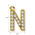 Gold rhinestone letter N pendant charm, elegant copper jewelry accessory detail view. - Letter N