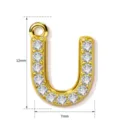 Detailed view of the 12mm gold letter U pendant showcasing sparkling zircon stones. - Letter U