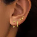 Gold-tone copper multi-piercing earring set featuring colorful crystal studs and hoop designs. - Light Green Rhinestone Style (款式18)