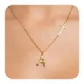 Gold-colored minimalist initial letter A pendant and side cross clavicle necklace detail shot. - Letter A