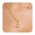 Detail close-up of the stylish gold initial letter D and cross pendant necklace worn on neck. - Letter D