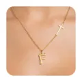Minimalist gold-tone necklace featuring an asymmetrical cross and letter F pendant. - Letter F