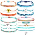 Detailed view of colorful woven cord bracelets set with various charms like sun and wave. - Sunflower Rainbow Style (36)