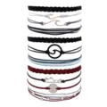 Close up of handmade braided rope bracelets set featuring wave, mountain and compass charms. - Wave Compass Multi-Layer Woven Bracelet (26) / Colorful