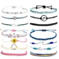 Handmade woven surf rope bracelet set with various charms like compass and sunflower. - Multi-Layer Surfing Style Woven Bracelet Set (24) / Colorful