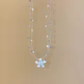 Deliziosa collana a fili trasparenti multistrato con un elegante ciondolo floreale in cristallo. - 11# Collana-Argento-Blu