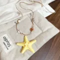 Collana stella marina resina boho con cordino pelle marrone accessorio moda donna. - #43 collana - giallo