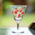 Clear glass stemmed tea cup featuring cute painted strawberry patterns, elegant drinkware. - Qinghuan High-Stem Tea Tasting Cups - Meihao Series