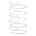 Set de 5 pulseras con dijes plateados con cadenas de extensión y colgantes de circonita. - Set de pulseras apilables / Paquete de 5 piezas / Color acero