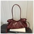 Wine red glossy patent leather shoulder bag, elegant hobo baguette handbag for women commuting. - Red