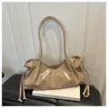 Beige patent leather shoulder bag, stylish ruched baguette tote for women daily commute. - Khaki