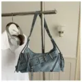 Vintage motorcycle style shoulder bag with distressed leather and metal buckle details. - Blue