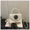 Elegant white underarm shoulder bag with chic textured flap and round clasp for daily commute - White