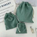 Three-piece green corduroy drawstring pouches on a desktop counter - Small (14*16cm) / Grass Green