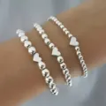 Silver beaded bracelet set with heart charms, stylish stretch stacking silver jewelry for women. - Heart Pendant Style (47) / Three-Piece Set / Silver