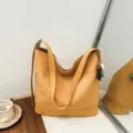 Stylish yellow woven bucket bag with shoulder strap and chic hanging beads for women. - With Pendant / Yellow