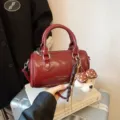 Red patent leather Boston bag stylish shoulder handbag for women daily commuting. - With Pendant / Red