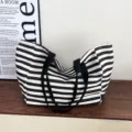 Black and white striped canvas tote bag, large capacity casual shoulder bag for daily commute. - Light Yellow