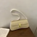 Woven texture baguette shoulder bag for women, stylish underarm handbag with gold lock. - Off White