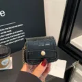 Mini black crocodile pattern crossbody bag with gold chain strap for fashionable women - Black