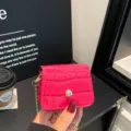 Hot pink patent leather mini crossbody bag with chic chain strap and snap closure design. - Rose Red