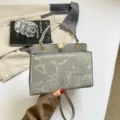 Grey stylish shoulder handbag with gold V lock, elegant commuter tote bag for women. - Gray