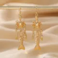 Unique gold-tone skeleton fish bone drop earrings for Halloween gothic dark style jewelry - Gold
