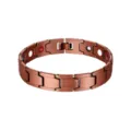 Detail van een koperkleurige magnetische armband met therapeutische steeninzetstukken - Brons