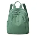 Casual green nylon backpack for women, multi-pocket stylish travel daypack front view. - Green Apple