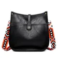 Black leather bucket crossbody bag with colorful geometric wide strap for women daily commute. - Black