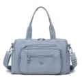 Light blue nylon shoulder bag for women, casual multi-pocket crossbody bag with top handles. - Blue