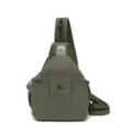 Green nylon sling bag for women, casual crossbody backpack with metal lock, stylish travel daypack. - Green