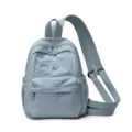 Light blue casual nylon convertible backpack with front pocket and adjustable straps for daily use. - Blue