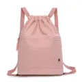 Pink drawstring backpack for women, casual large capacity gym sports knapsack with front zipper pocket. - Pink