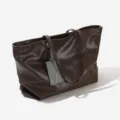 Large capacity brown leather tote bag for women, stylish commuting shoulder bag with tag. - Brown