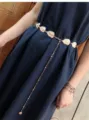 Detailed shot of gold metal leaf belt accessory chain showcasing delicate craftsmanship. - Leaf Waist Chain in Gold Color