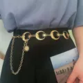 Gold metal moon and sun waist chain closeup, fashion body jewelry accessory for women. - Moon & Star Waist Chains - Gold