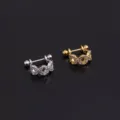 Details of stainless steel cubic zirconia cartilage ear piercing stud in silver and gold. - Interwoven Geometric U-Shaped Style (Style 4) / Silver